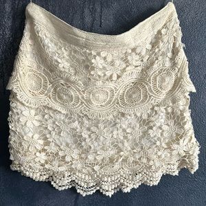 Free People cream crochet mini skirt.